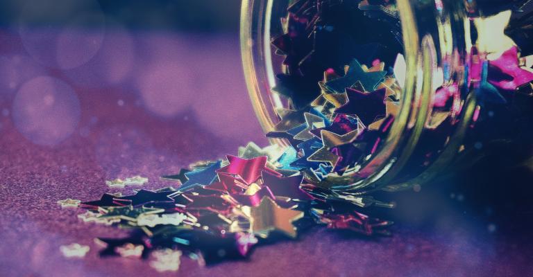 Star confetti spilling from a jar