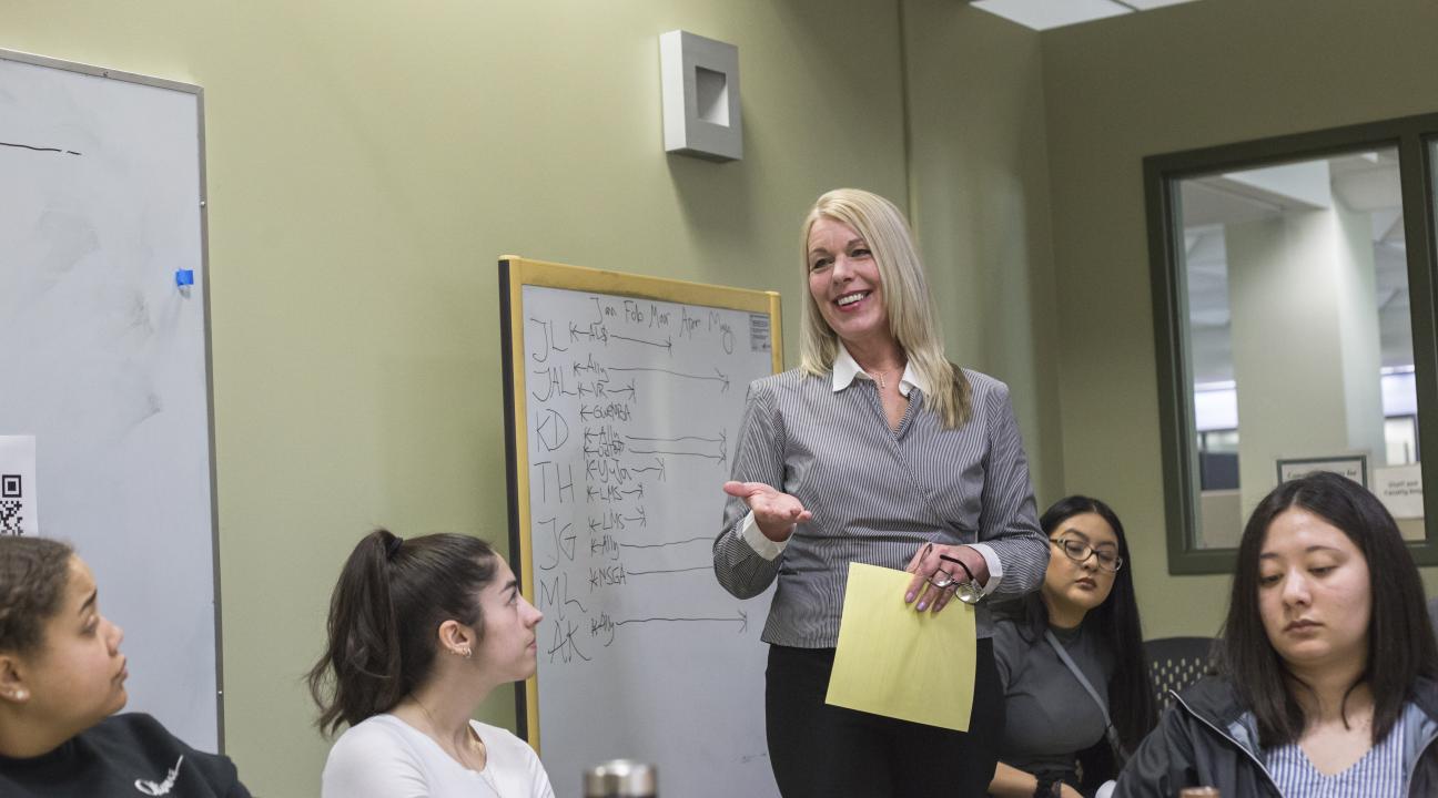 Stacey Pelton, McNair Research Coordinator, delivering content at a workshop