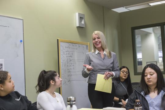 Stacey Pelton, McNair Research Coordinator, delivering content at a workshop